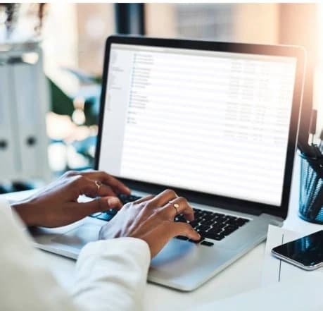 a person typing on a laptop - photo by Cytonn Photography - Unsplash